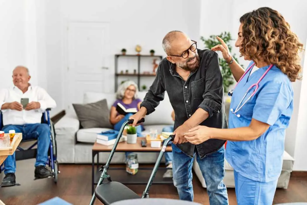 Female nurse helping home care patient who has medicare home health.