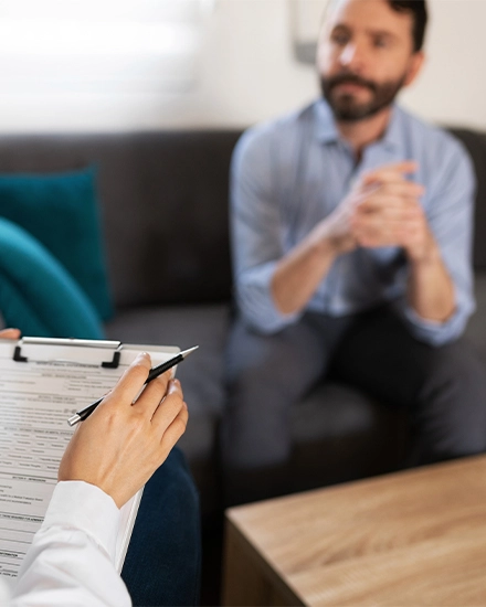 Man sitting on couch getting therapy in El Paso