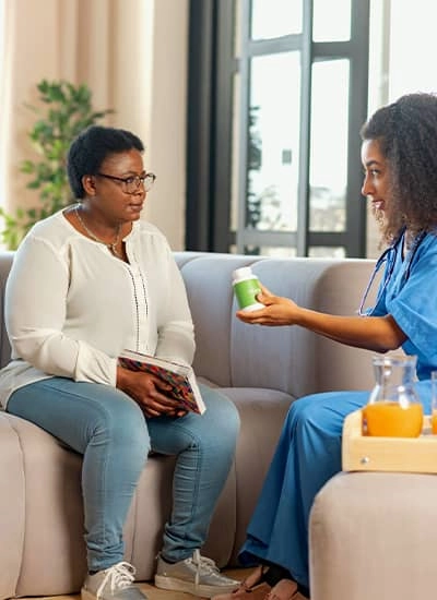 A nurse with patient in their home as they perform home care in Clint, TX