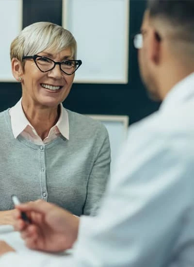 Women and doctor talking about hospice care and home health care services 
