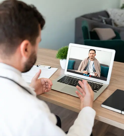 Person on computer screen receiving online therapy in El Paso