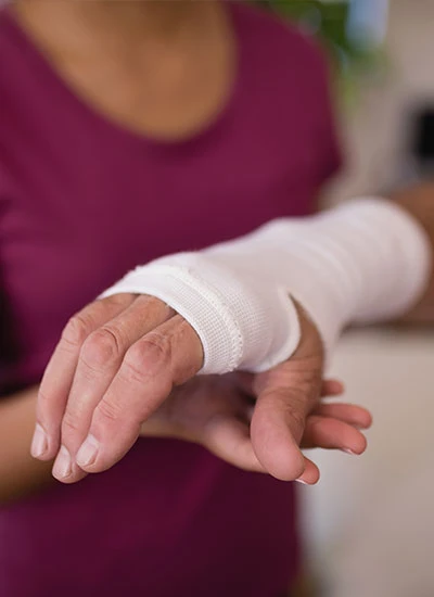 Nurse wrapping wound. Providing wound care in San Elizario.